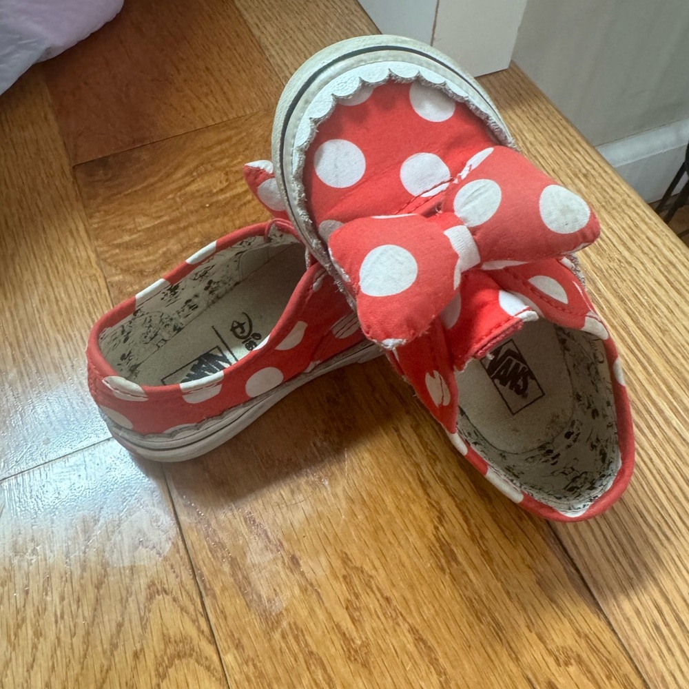 Pair of Minnie Mouse shoes. Red are vans slip on. Grey light up.